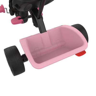 Close-up of the lower rear part of the TP Toys Zoomee 4 in 1 Trike - Unicorn Dream, highlighting two black wheels and a pink plastic storage basket.