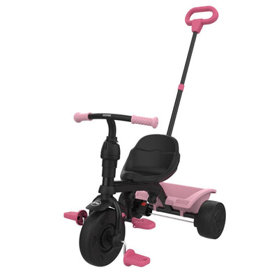 The TP Toys Zoomee 4 in 1 Trike - Unicorn Dream is a black and pink trike for young kids, featuring a push handle, footrests, pedals, and a playful unicorn design.