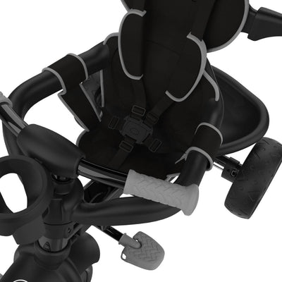 Close-up of the TP Toys Zoomee 4 in 1 Deluxe Trike - Grey Storm seat and handlebars, featuring a safety harness, pedal, and rear wheel.
