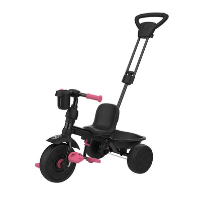 The Zoomee 4 in 1 Deluxe Trike - Pink Dusk by TP Toys features a push handle, front basket, and rear storage tray—a versatile black and pink tricycle designed for young kids.