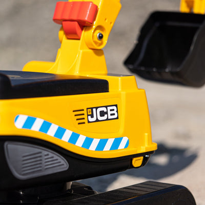 Close-up of the TP Toys Falk JCB Fully Articulated Digger with opening seat and helmet, ideal for construction role play.