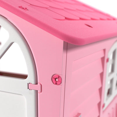 Close-up of the corner of the TP Toys Palplay Plastic Playhouse of Fun - Candy Floss Edition, highlighting its pink and white door, wall, and roof.