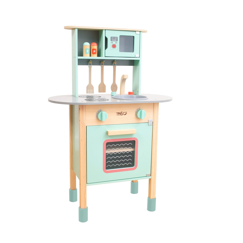 The TP Toys Owl & Fox Wooden Early Years Kitchen Set is FSC® certified and features an oven, stove, sink, utensils, spice bottles, and a microwave in pastel colors with natural wood accents—perfect for Montessori-inspired pretend play.