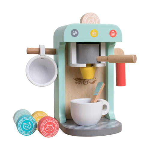 The TP Toys Owl & Fox Wooden Coffee Machine - FSC® certified set includes a green and gray coffee maker, two cups, a spoon, and four colorful capsules—ideal for pretend play fun.