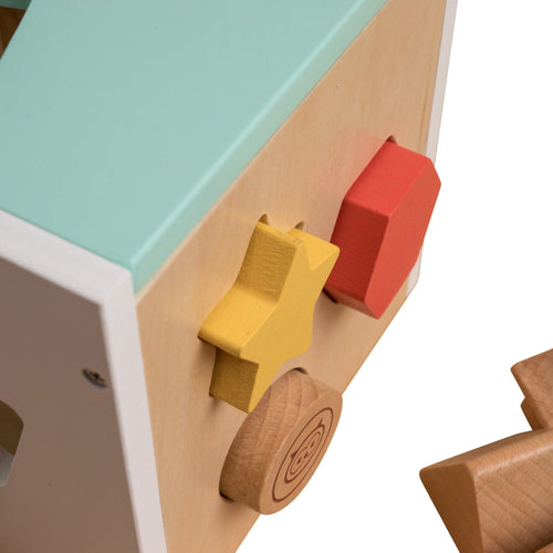 The Owl & Fox Wooden Shape Sorter by TP Toys features a shape sorter with a yellow star, red square, and circular and triangular blocks near their matching cutouts.