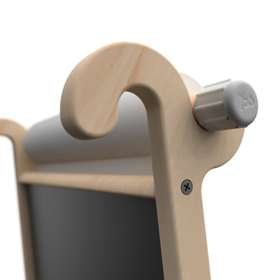Close-up of the TP Active-Tots Pikler Style Wooden Easel Play Accessory by TP Toys featuring a curved top, gray knob, chalkboard, and paper scroll holder; made from FSC® certified wood.