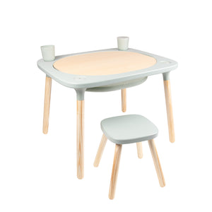 The TP Toys TP Active-Tots Pikler Style 4 in 1 Wooden Play Table with Play Stool is a small, lightweight FSC® certified kids’ table and stool set, perfect for Montessori activities, shown with two cups on its round wooden center against a white background.