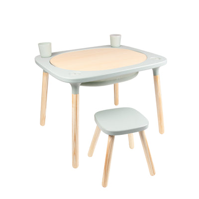 The TP Toys TP Active-Tots Pikler Style 4 in 1 Wooden Play Table with Play Stool is a small, lightweight FSC® certified kids’ table and stool set, perfect for Montessori activities, shown with two cups on its round wooden center against a white background.
