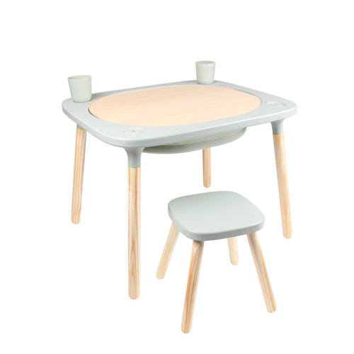The TP Toys TP Active-Tots Pikler Style 4 in 1 Wooden Play Table with Play Stool is a small, lightweight FSC® certified kids’ table and stool set, perfect for Montessori activities, shown with two cups on its round wooden center against a white background.