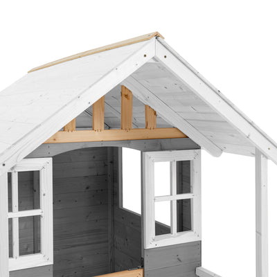 The TP Toys TP Snowdrop Cottage Wooden Playhouse is a partially assembled FSC® certified childrens playhouse, painted white and gray, featuring two window openings and an unfinished roof.