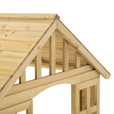 Close-up of the TP Toys Dandelion Cottage Wooden Playhouse—FSC® certified—featuring a roof, triangular gable, and partial wall with vertical slats, perfect for imaginative role play.