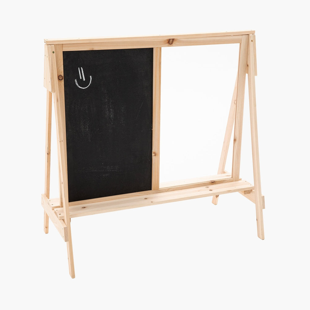 The TP Toys TP Two-Way Play Easel features a black chalkboard with a white chalk smiley face on the left and a blank whiteboard on the right, offering double-sided creative fun for kids.