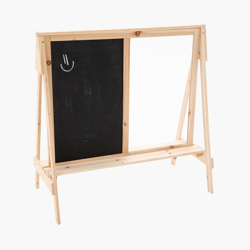 The TP Toys TP Two-Way Play Easel features a black chalkboard with a white chalk smiley face on the left and a blank whiteboard on the right, offering double-sided creative fun for kids.