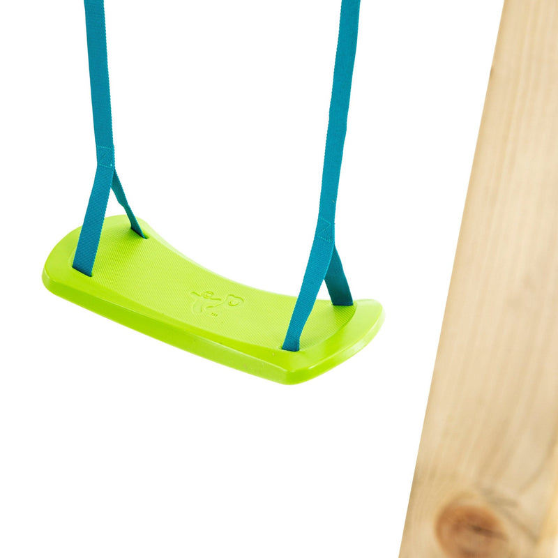 A green plastic swing seat with blue straps hangs from the TP Toys Skywood Wooden Tower Climbing Frame with Ripple Slide, Monkey Bars & Double Swing Arm (FSC® certified), its sturdy frame isolated on a white background.