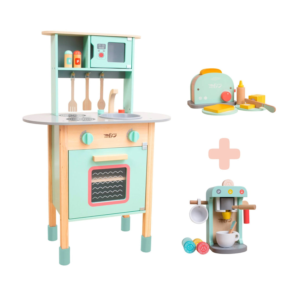 The TP Toys Owl & Fox Wooden Early Years Kitchen Set includes a stove, oven, microwave, FSC®-certified toaster with food, and a coffee machine—perfect for imaginative play.