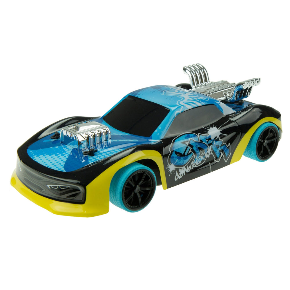 The TP Toys Exost Xmoke is a remote controlled racing car featuring a blue and black body, yellow front bumper, blue wheels, and chrome engine details for the ultimate racing experience.