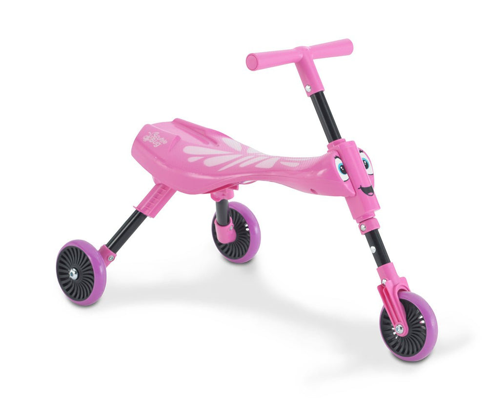 The TP Toys Scuttlebug Butterfly Foldable Ride On Trike is a pink three-wheeled toddler trike with a smiling face design on the front and adjustable handlebars.