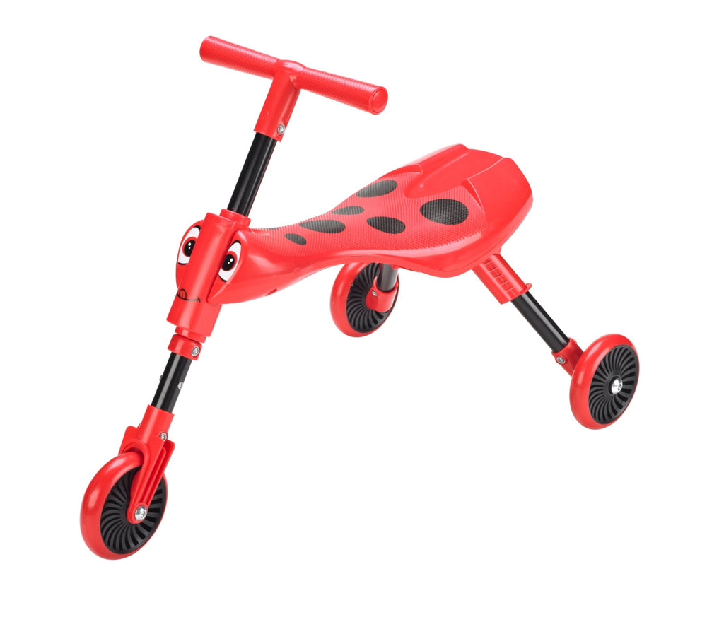 The Scuttlebug Beetle Foldable Ride On Trike by Scuttlebug is a red and black childrens tricycle, featuring cartoon eyes and a stable three-wheel design inspired by a ladybug.