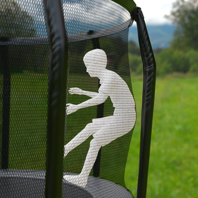 A child silhouette appears through the safety net of the 10ft Akrobat Fenix Trampoline by TP Toys, set on a grassy field with trees and hills, featuring a perforated jumping mat for better bounce and airflow.