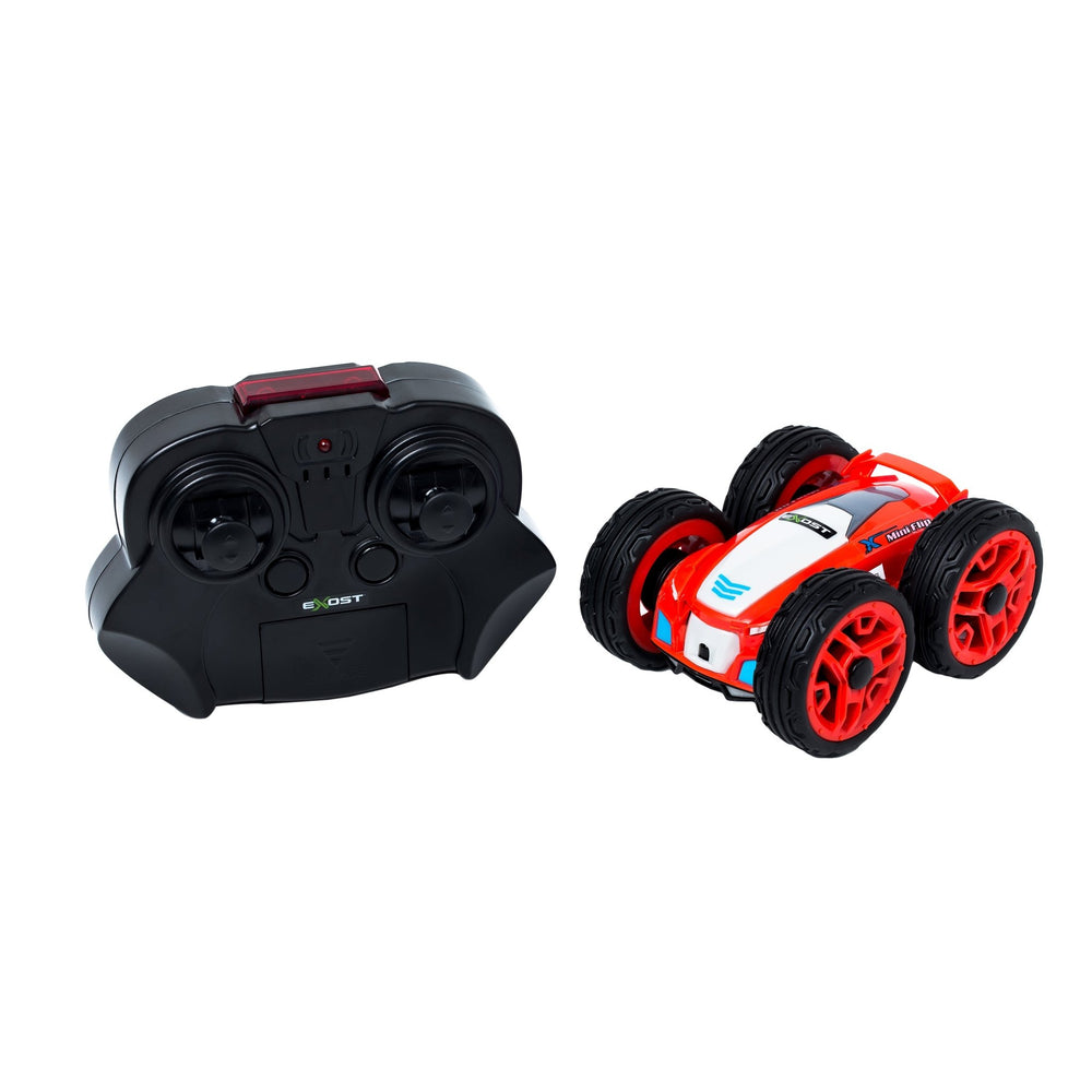 The TP Toys Exost 360 Mini Flip, a red and white stunt car, is displayed beside a black remote control on a white background.