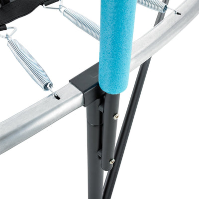 Close-up of the TP Toys Genius® 14ft Round Trampoline, featuring a galvanised steel frame, metal springs, sturdy black legs, and a padded blue SurroundSafe enclosure pole.