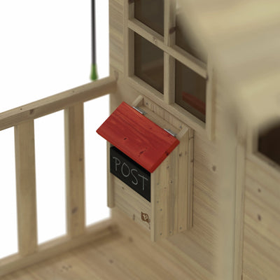 The TP Toys Lavender Cottage Playhouse with Bell, Postbox & Picket Fence (FSC® certified) features a wall-mounted red-roof postbox labeled POST by the window and railing—ideal for imaginative play.