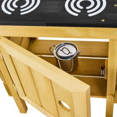 The TP Toys TP Junior Chef Wooden Mud Kitchen, made from FSC® certified wood, features a partially open cabinet showing a metal pot inside and visible stovetop burners on the counter above.