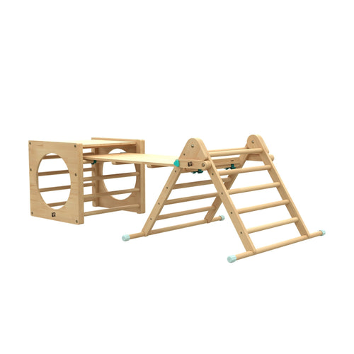 The TP Toys TP Active-Tots Pikler Style Wooden Climbing Triangle, Cube & Slide is an FSC® certified indoor playset featuring a cube with circular openings, climbing triangle, and detachable slide—perfect for adventurous indoor play.