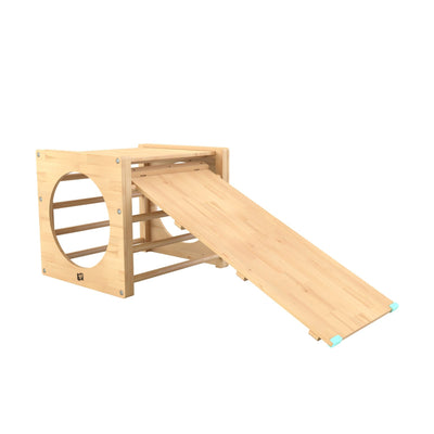 The TP Active-Tots Pikler Style Wooden Climbing Cube & Slide by TP Toys is an FSC® certified indoor play frame featuring a circular opening and inclined ramp, making it perfect for childrens active play or physical activity.