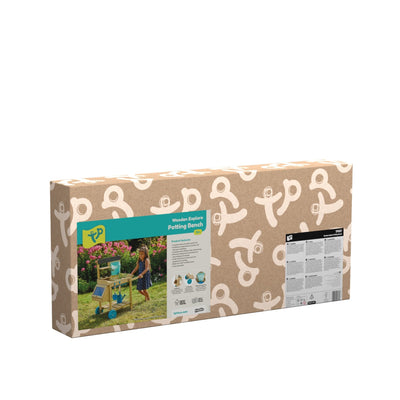 A box of a child’s picture sits on the TP Wooden Explore Potting Bench by TP Toys, FSC® certified, adding memories and charm to the table.