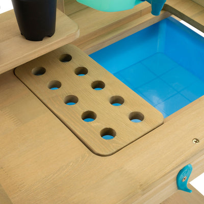 The TP Toys TP Wooden Explore Potting Bench - FSC® certified features a blue tray and container, making it ideal as a children’s gardening station.
