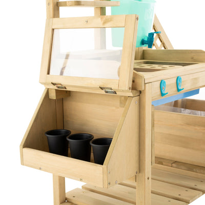 The TP Wooden Deluxe Potting Bench by TP Toys is FSC® certified and features an open compartment, three small black plastic pots, and a clear hinged lid—ideal for organizing gardening play accessories.