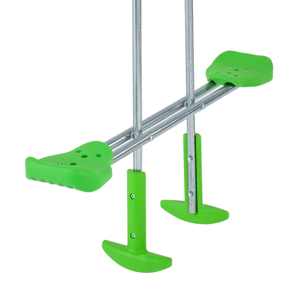 A close-up of the TP Toys TP Glide Ride with Duo Ride Bracket for Knightswood features its green and silver design, detailed footrests, and sturdy bottom tips—ideal for outdoor fun.